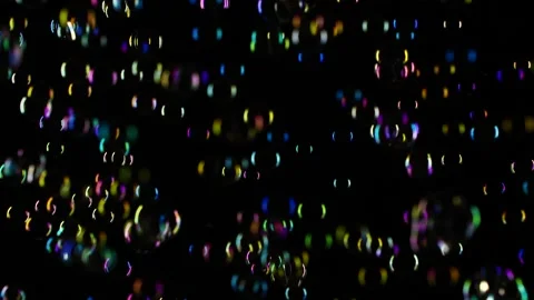 Slow motion of soap water bubbles texture flying over black abstract background Stock Footage 171803321