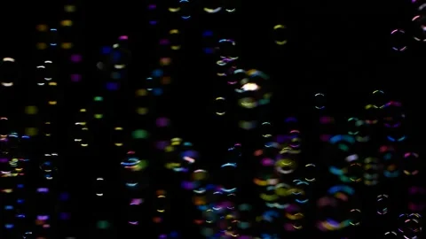 Slow motion of soap water bubbles texture flying over black abstract background Video stock 171955421