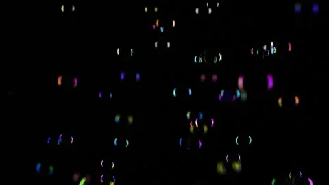 Slow motion of soap water bubbles texture flying over black abstract background Stock Footage 172181266
