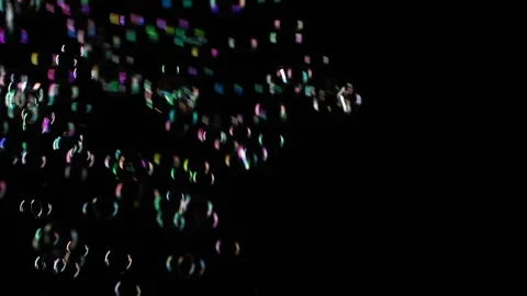 Slow motion of soap water bubbles texture flying over black abstract background Stock Footage 176714987