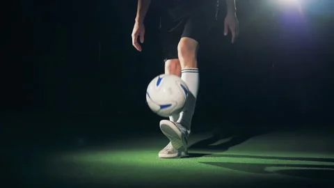 Slow motion soccer player playing with a football ball making tricks. Stock Footage 87312400