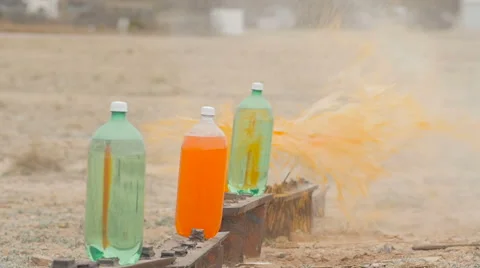 Slow Motion Soda Bottle Target Practice Stock Footage 60665085