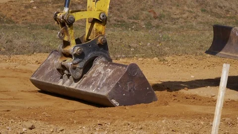 Slow motion of Soil digging machine preparing terrain. Close up. Stock Footage 117021291