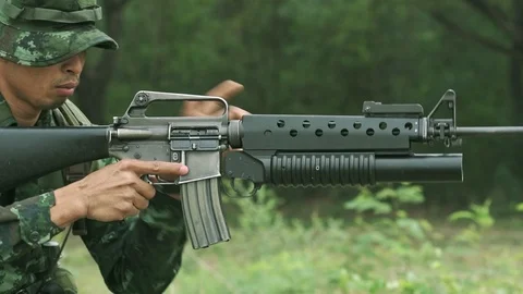Slow motion of soldier reloading his weapon. Stock Footage 92309840