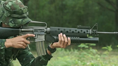 Slow motion of soldier reloading his weapon. Stock Footage 92314495