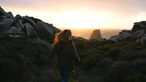 Slow motion of solo adventure of young woman hiking watching horizon Stock Footage 104577295