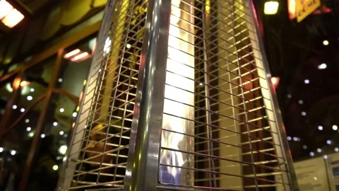 Slow Motion Space Heater with twinkle lights reflecting off mirror Stock Footage 212178667