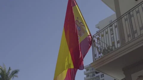 Slow motion of Spanish flag moved by the wind Stockbeeldmateriaal 140060447