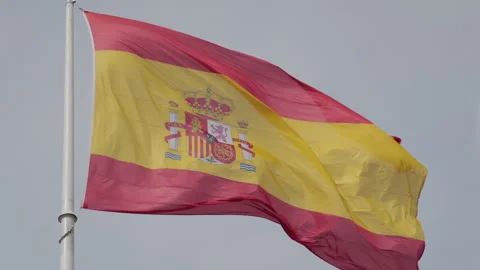 Slow motion of spanish flag waving with sky in background Stock Footage 266657994
