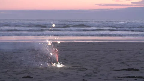 Slow Motion Sparkler on beach at sunset Video stock 165300637