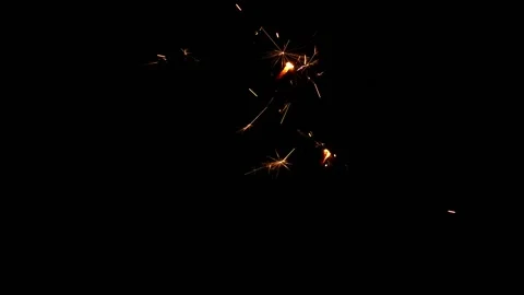 Slow motion of sparkler lights explosion on black background. Christmas design. 库存影片 142416591
