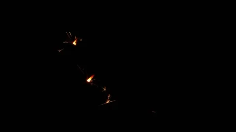 Slow motion of sparkler lights explosion on black background. Christmas design. Stock Footage 142853664