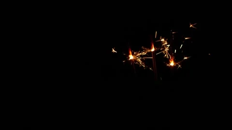 Slow motion sparkler lights explosion on black background, fireworks sparkling Stock Footage 144681175