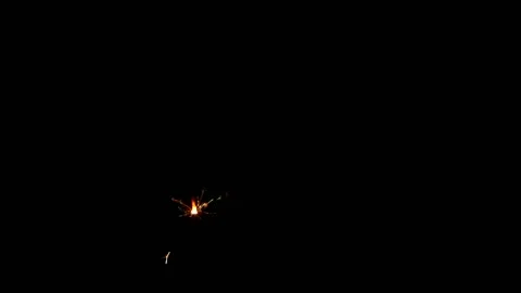 Slow motion sparkler lights explosion on black background, fireworks sparkling Stockbeeldmateriaal 145046828