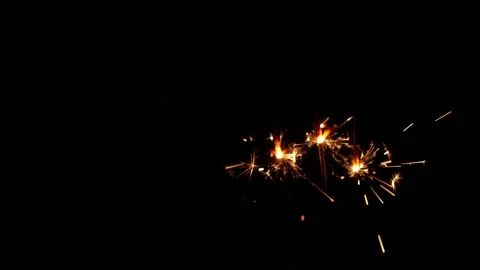 Slow motion sparkler lights explosion on black background, fireworks sparkling Stock Footage 145179871