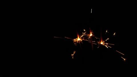 Slow motion sparkler lights explosion on black background, fireworks sparkling Vídeos de archivo 146051951