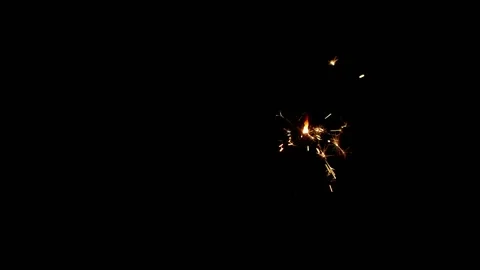 Slow motion sparkler lights explosion on black background, fireworks sparkling Stock Footage 147423157