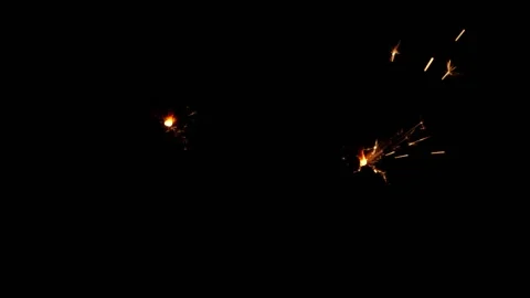 Slow motion sparkler lights explosion on black background, fireworks sparkling Stock Footage 149859908