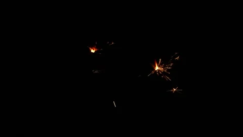 Slow motion sparkler lights explosion on black background, fireworks sparkling Stock Footage 151569481