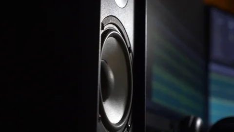 Slow motion Speaker Vibrating Playing Loud Music Beat Near Computer Monitor 4K Stock Footage 107571601