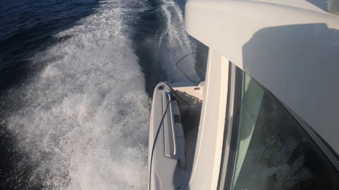 Slow motion of a speedboat moving through the ocean water Stock Footage 122411816