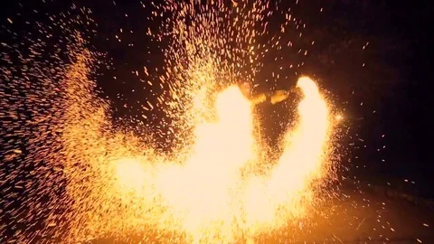 Slow motion. Spinning firework wheel, sparkles all around. Fire show. Fireworks Stock Footage