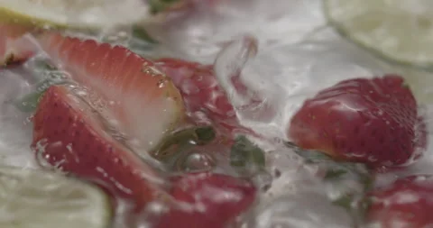 Slow Motion Splash: Lemons and Strawberries Falling into Water - Vibrant Fruit Stock Footage 273531744