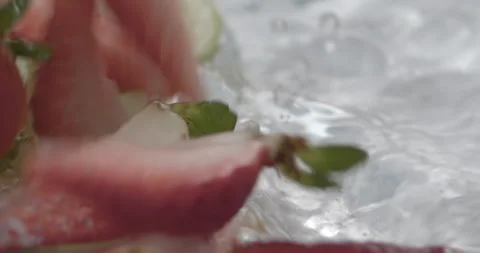 Slow Motion Splash: Lemons and Strawberries Falling into Water - Vibrant Fruit Stock Footage 273531762