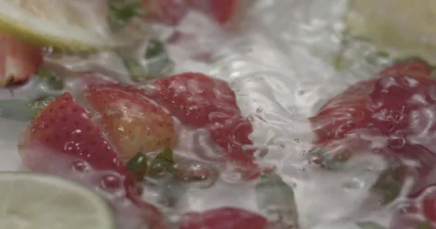 Slow Motion Splash: Lemons and Strawberries Falling into Water - Vibrant Fruit Video stock 273532134