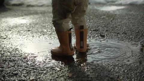 Slow motion splash in puddle Stock Footage 144632781