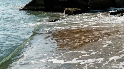 Slow motion. Splashes are approaching, splash of waves on shore against the Stock Footage 155074115