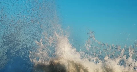 Slow motion splashes waves on pier background blue sky on spring sunny day Stock Footage 126322677