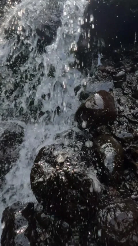 Slow motion of splashing waterfall falling on rocks Stock Footage 319921405