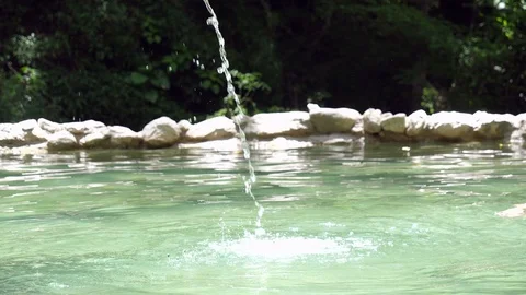 Slow motion splasing water jet in a hot springs in the Caribbean Stock Footage 91195486