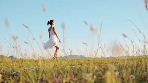 Slow motion. The splendor of free flight in dance. A chic young woman in a white Stock Footage 279072076