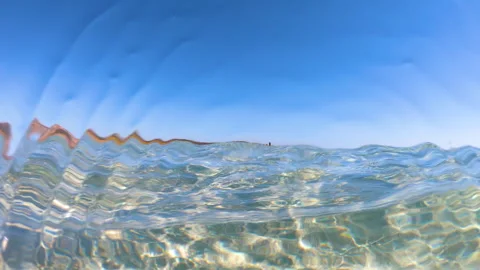 Slow motion split underwater view of La Pelosa beach Stock Footage 333121199