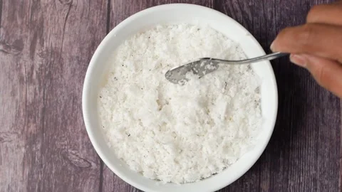 Slow motion of spoon pick slice of fresh coconut flakes Stock Footage 229302426