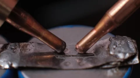 Slow Motion Spot Welding Lithium Battery with Electrodes Macro Stock Footage 306214999