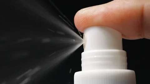 Slow motion of spray bottle drops on black background Video stock 113593878