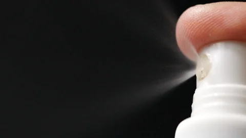 Slow motion of spray bottle drops on black background. Stock Footage 113593883