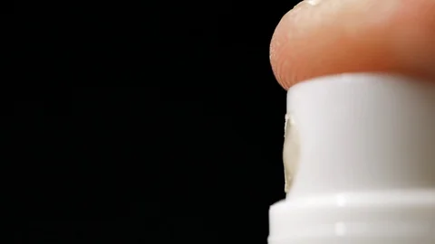 Slow motion of spray bottle drops on black background. Stock Footage 113593897