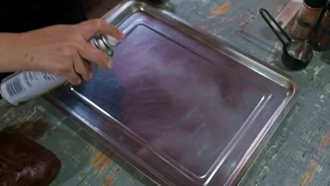 Slow Motion Spraying Baking Tray With Cooking Oil Stock Footage 321382475