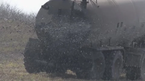 Slow motion of spreading slurry on a field, close Stock Footage 152848228