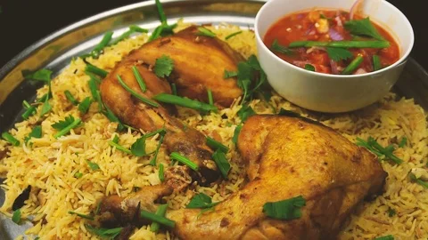 Slow motion of  spreading spring onion on the plate of  chicken mandy rice with  Stock Footage 105382565