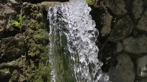 Slow motion spring water flow Stock Footage 158319690