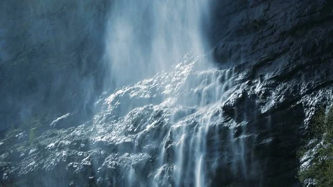 Slow motion of spring waterfall. fresh natural water source  Stock Footage 72870499