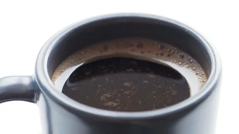 Slow motion of sprinkle cup of coffee with cinnamon. Stock Footage 112669796