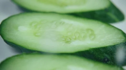 Slow motion. Sprinkle fresh cucumber with salt Stock Footage 75568230