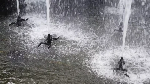 Slow motion of sprinkler throwing water in a urban pond in Funchal city, Madeira Stock Footage 114816083