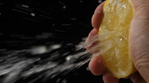 Slow Motion squeeze juice from lemon close up Stock Footage 111868313